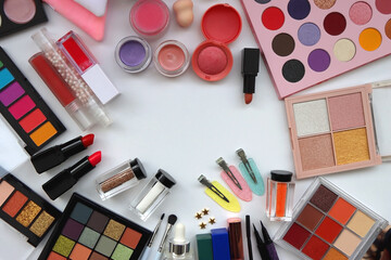 Various colorful beauty products on white background. Top view.