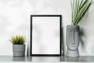 Black Wooden Frame Gray Vase With Plant Leaves Against White Wall