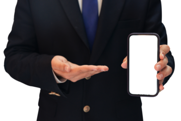 Man showing the Mobile white isolated screen in one hand and pointing towards it with other hand wearing a professional suit with tie, transparent PNG background