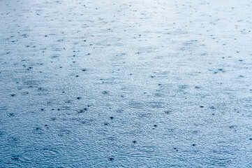 River in the rain. Water surface during a downpour