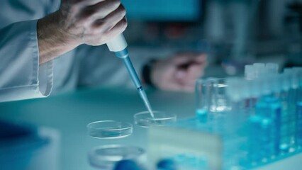 Close Up of a Scientist Pouring Clear Liquid into Glass Dishes with a Micro Pipette, Conducting Scientific Experiment in Laboratory Setting. Chemistry Concept for Medical Research and Analysis - Powered by Adobe