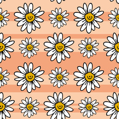 Seamless pattern with chamomile on light orange background. Vector image.