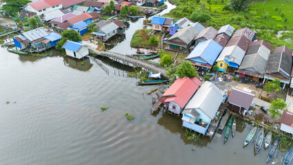 View of a residential village on the riverbank of South Kalimantan from a drone during the day