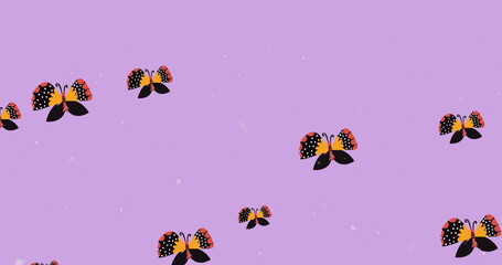 Fototapeta premium Digital image of multiple butterfly icons and white particles floating against purple background