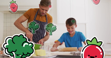 Image of smiling vegetables over happy caucasian father and son cooking at home - obrazy, fototapety, plakaty