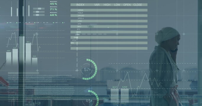 Image of financial data processing over biracial businesswoman in office - Powered by Adobe