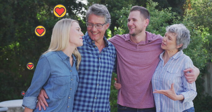 Image of failing hearts icons over caucasian family outside