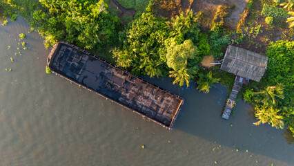 aerial view of a coal barge passing through a South Kalimantan river