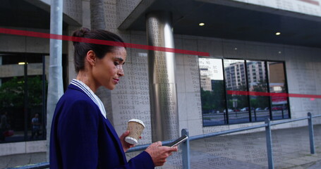Image of data processing over biracial businesswoman using smartphone in street
