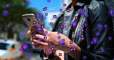 Image of globe of networks with digital icons over caucasian woman using smartphone