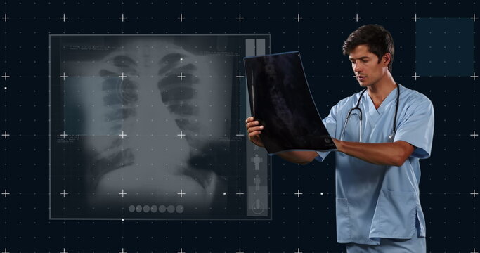 Image of caucasian male doctor with x ray photo and x ray photo on black background
