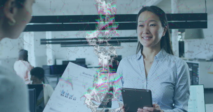 Image of dna strand over diverse business people in office