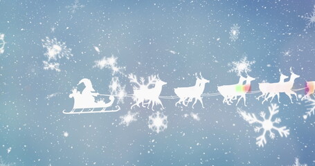 Image of santa claus in sleigh with reindeer over snow falling in winter scenery