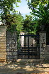 Gates and wickets, iron bars and forged patterns on the doors. City views on the streets, public...
