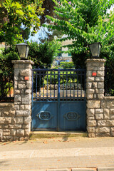 Gates and wickets, iron bars and forged patterns on the doors. City views on the streets, public...