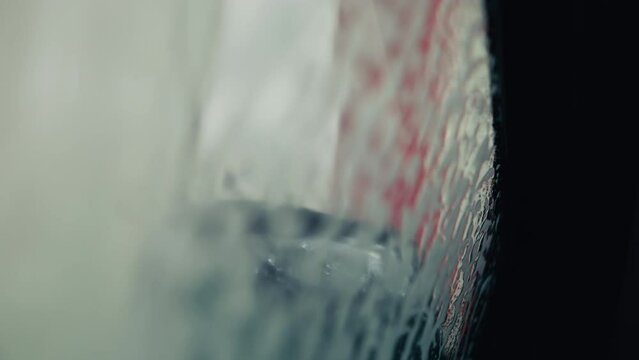 Suds and Shine: Experience the magic of an automatic car wash from the comfort of the driver's seat as your vehicle is enveloped in foamy goodness, filmed from inside for a unique perspective.