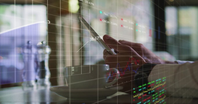 Image of stock market data processing over mid section of a man using digital tablet at a cafe