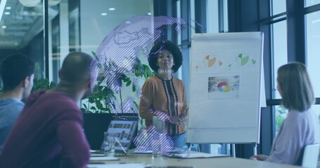 Image of globe and data processing over business people in office