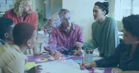 A group of happy diverse business people are discussing work during a meeting at a modern office