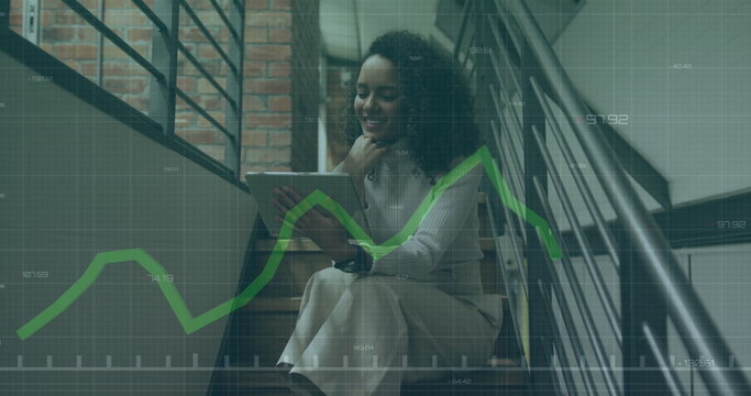 Image of financial data processing over biracial businesswoman in office