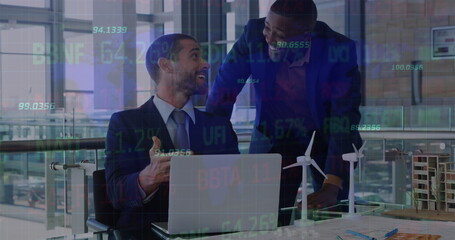 Image of stock market data processing over two diverse businessmen discussing at office