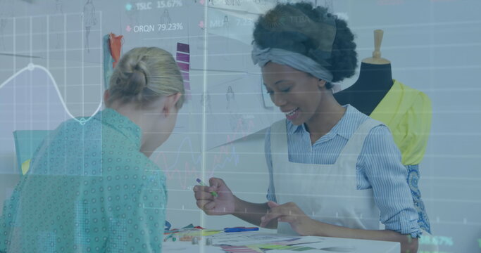 Image of financial data processing over diverse businesswomen in office - Powered by Adobe
