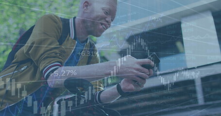 Image of financial data processing over man using smartphone