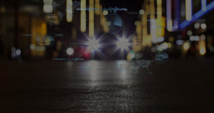 Image of round scanners and data processing against city traffic at night