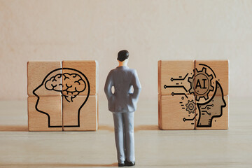 Businessman focus on wooden cubes with AI icon idea for Technology for business,artificial...