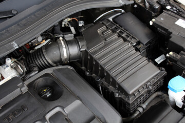 Modern car air supply system. Car air filter. Modern car engine parts.