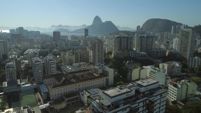 Aerial sweeping past high rises with Sugarloaf Mountain and Guanabara Bay in the background, Rio de Janeiro, Brazil