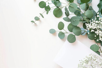 edding invitation card mockup with natural eucalyptus and white gypsophila plant twigs.