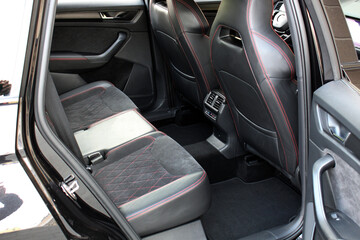 Sport SUV rear seats. Sport SUV interior. Premium car Back passenger seats with armrest. Sport SUV leather interior. Sport car interior.