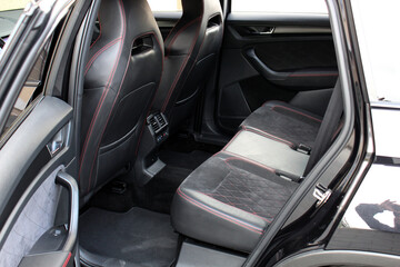 Sport SUV rear seats. Sport SUV interior. Premium car Back passenger seats with armrest. Sport SUV leather interior. Sport car interior.