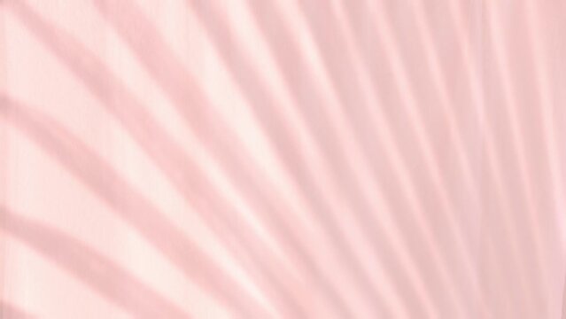 Soft tropical palm shadow falls gracefully on peach curtain, fabric gently flutters tranquil waving, minimalistic tropical background, relaxation and calm, serene backdrop for productivity