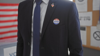 American man in suit with voting sticker at electoral polling center with us flag