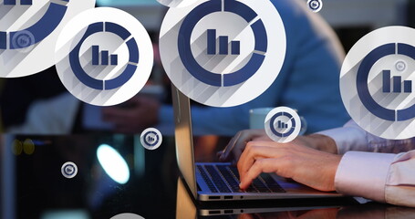 Image of graph icon in circles over cropped hands of caucasian man typing on keyboard of laptop - Powered by Adobe