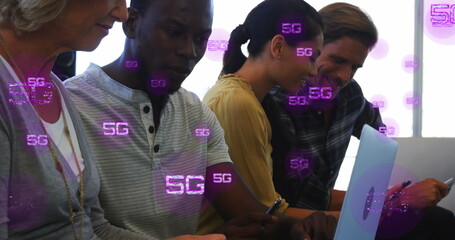 Image of multiple 5g texts over diverse coworkers sharing ideas in office