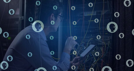Image of grid of people icons over asian male technician working in server room