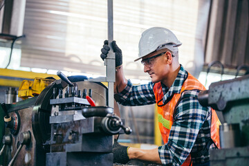 Male engineer metalworker industrial experienced operator technician worker in safety hard helmet...