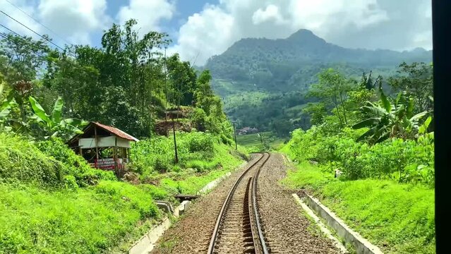 View of the green landscape of Java Island from Indonesian train