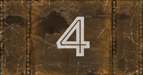 Digital composite of vintage film countdown image with flickering in foreground 4k