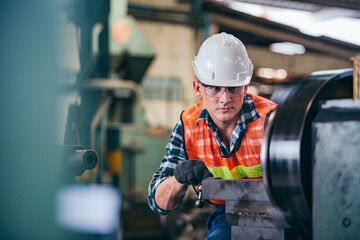 Male engineer metalworker industrial experienced operator technician worker in safety hard helmet...