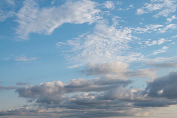 Blue sky with white and gray clouds