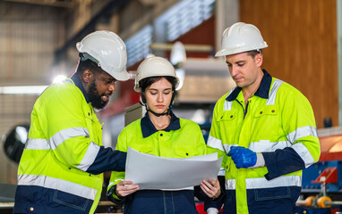 Professional team labor machanic engineer technician worker industrial work control with machine,  manufacturing,  factory, production line, Indusry 4.0, robot, industrial facility.business planning