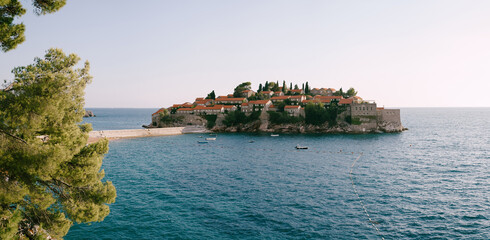 View from the shore to the island of Sveti Stefan in the Bay of Kotor. Montenegro - obrazy, fototapety, plakaty