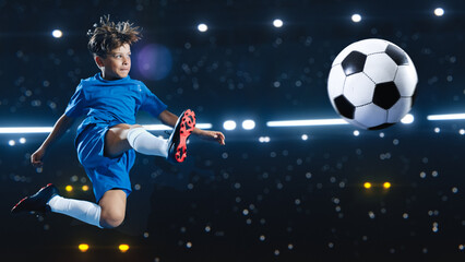 Aesthetic Shot Of Athletic Child Soccer Football Player Jumping And Kicking Ball Mid Air On Black...