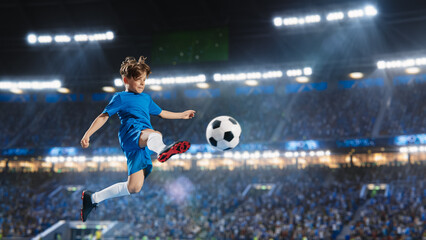 Aesthetic Shot Of Athletic Child Soccer Football Player Jumping And Kicking Ball Mid-Air On Stadium WIth Crowd Cheering. Young Boy Scoring a Winning Goal on Junior World Championship Tournament Match.