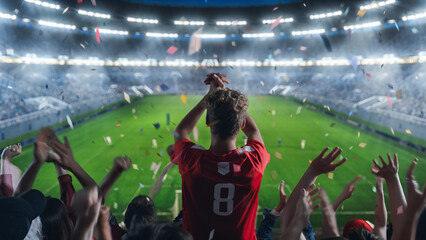 Aesthetic Shot of Fans Cheer for the Team on a Stadium During Soccer Championship Match. Team...
