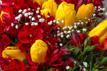 Bouquet of yellow and red flowers. Bouquet with yellow tulips